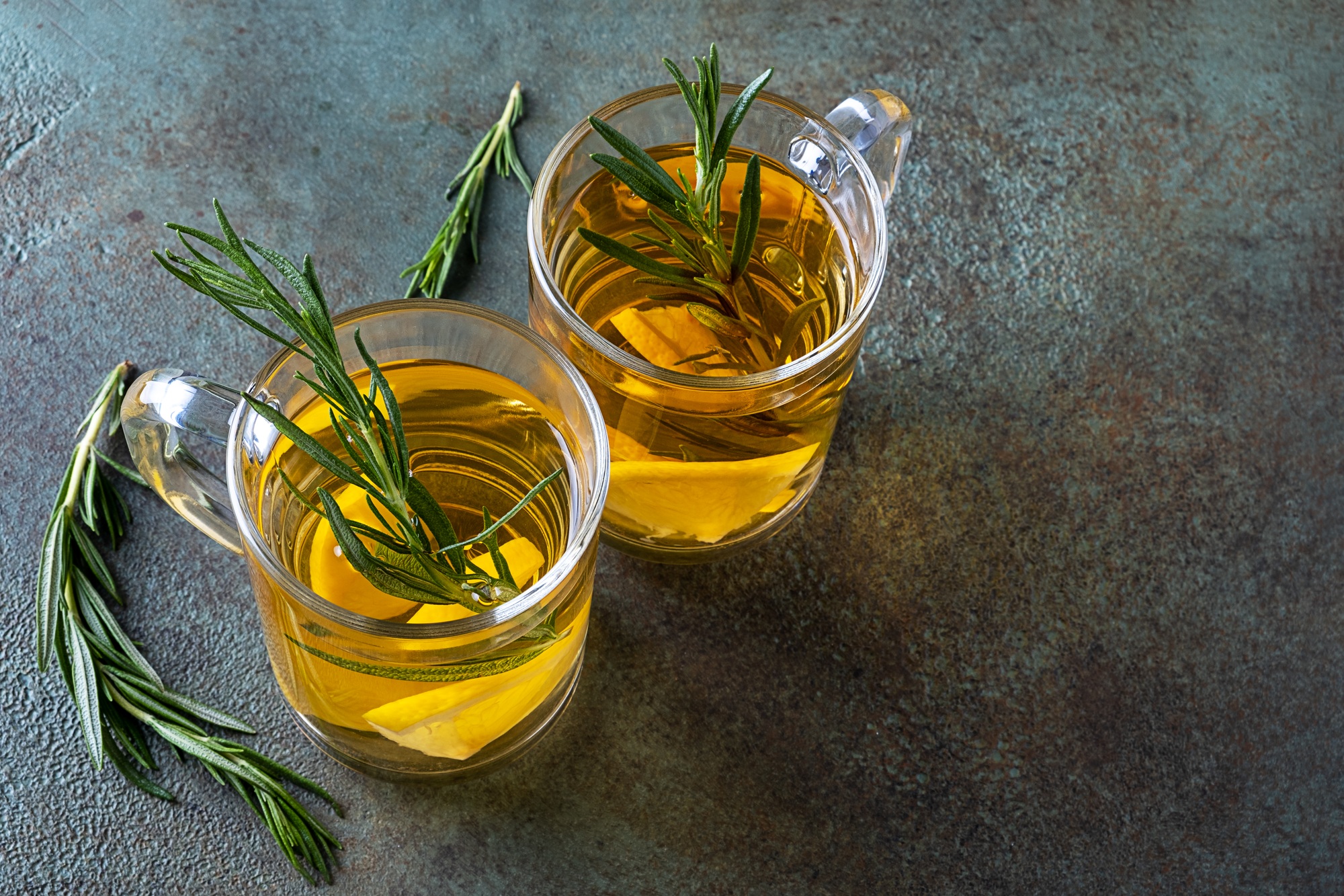 Rosemary tea in two glass cups.
