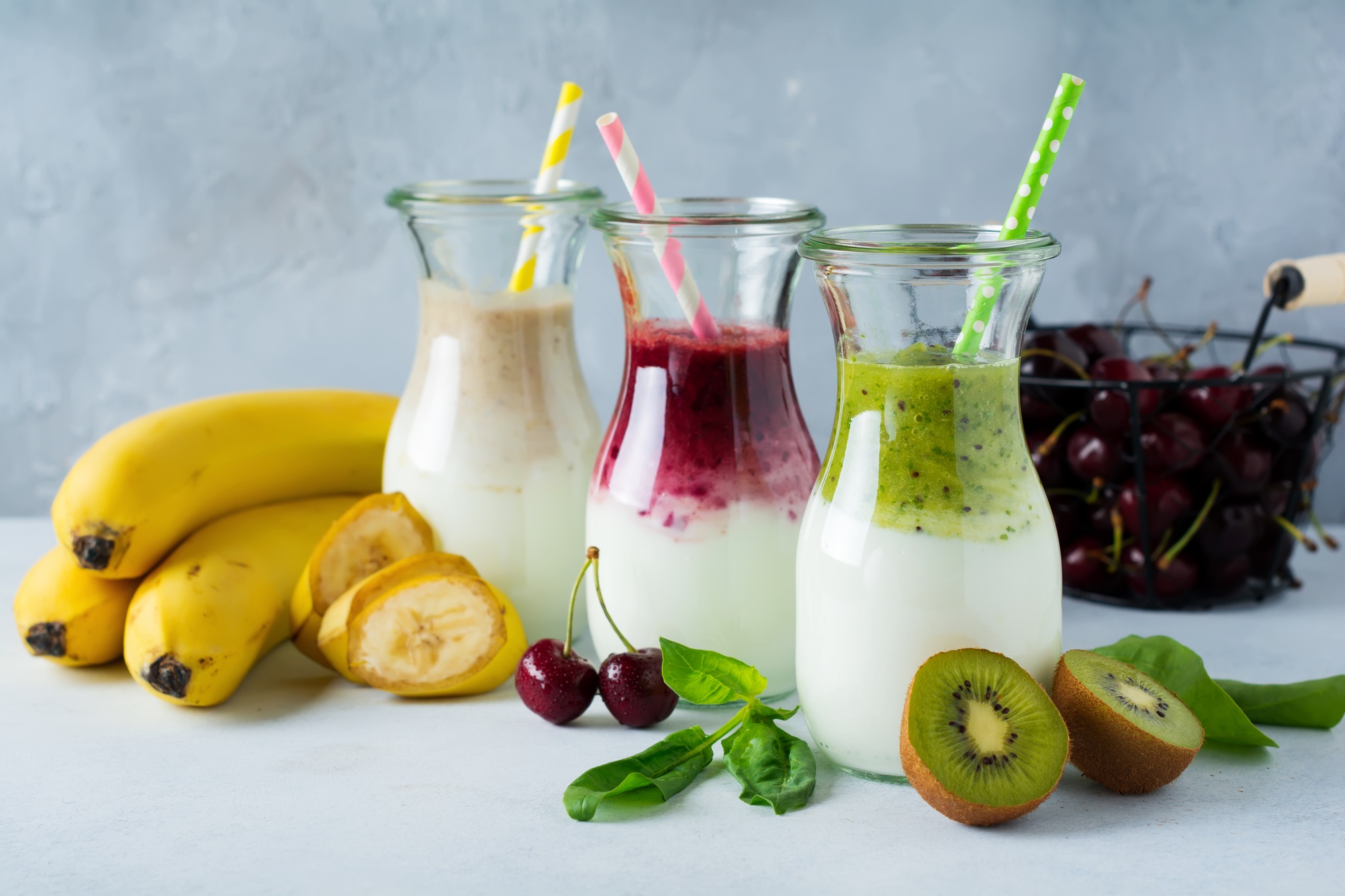 Set of fresh smoothies. Banana, cherries, kiwi and spinach for healthy eating, detox, diet food. Sel